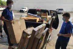 Christie Brown, CEO, assisting with loading of items